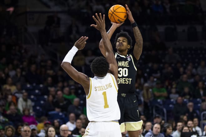 Wake Forest's Damari Monsanto (30) shoots as Notre Dame's JJ Starling (1) defends during Wake's 81-64 road win on Saturday.