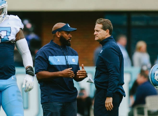 Gene Chizik (right) was brought in to change UNC's defense, but so far, the results haven't been there.