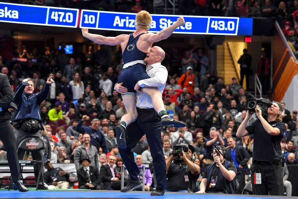 Sanderson lifts Nickal into the air after after his championship-winning pin at 184 pounds.