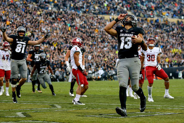 BOULDER, CO - NOVEMBER 19: Quarterback Sefo Liufau #13 of the Colorado Buffaloes celebrates his third quarter touchdown against the Washington State Cougars at Folsom Field on November 19, 2016 in Boulder, Colorado. Colorado defeated Washington State 38-24. (Photo by Justin Edmonds/Getty Images)