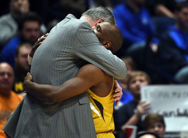 Kim Anderson fought back tears as he hugged Terrence Phillips on the Tiger bench