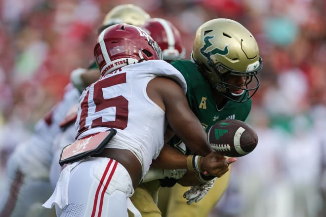 Alabama Crimson Tide linebacker Dallas Turner (15) forces a fumble by South Florida Bulls quarterback Byrum Brown (17) in the second quarter at Raymond James Stadium. Photo |  Nathan Ray Seebeck-USA TODAY Sports