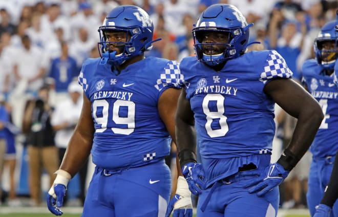Sophomore defensive linemen Josaih Hayes (99) and Octavious Oxendine (8) have emerged as key parts of the UK defense.