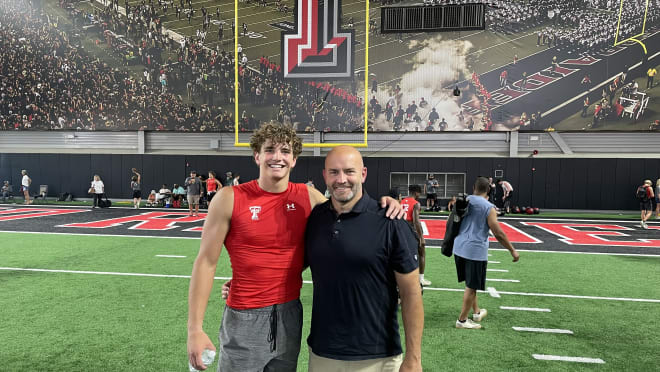 Jackson Ford with his dad at Texas Tech's football camp in June