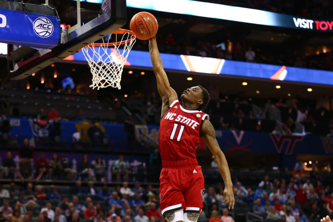 NC State Wolfpack basketball guard Markell Johnson goes for a dunk.