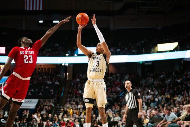 Hunter Sallis shoots over N.C. State's Mohamed Diarra on Saturday. 