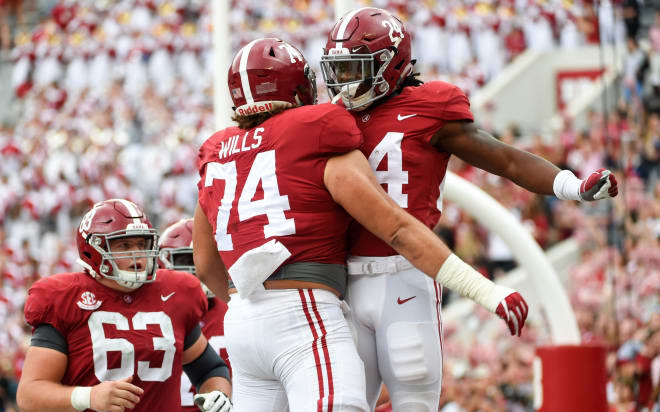 Alabama Crimson Tide running back Brian Robinson Jr. (24) celebrates with Alabama Crimson Tide offensive lineman Jedrick Wills Jr. (74) after scoring a touchdown against the Mercer Bears during the third quarter at Bryant-Denny Stadium. Photo | USA Today