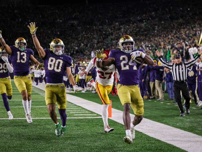 Notre Dame running back Jadarian Price, right, returned a kickoff 99 yards for a touchdown against USC.