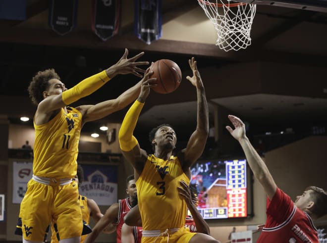 The West Virginia men's basketball team defeated the Western Kentucky Hilltoppers on Friday.
