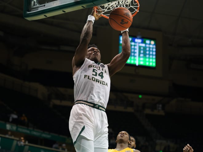 South Florida Bulls center Russel Tchewa finishes a dunk during a game at the Yuengling Center