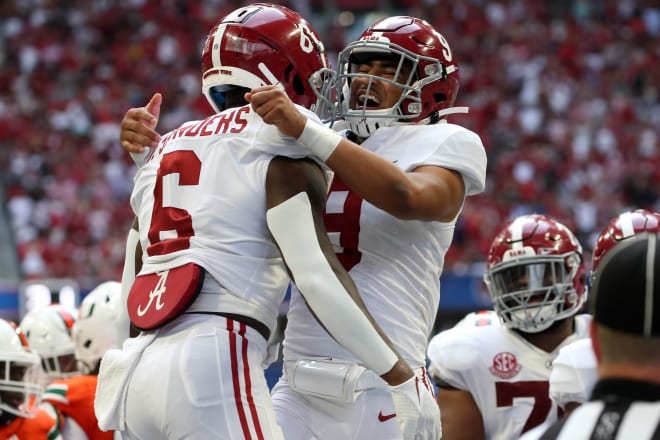 Alabama Crimson Tide quarterback Bryce Young (9) hugs running back Trey Sanders (6) following a touchdown against Miami. Photo | Getty Images 