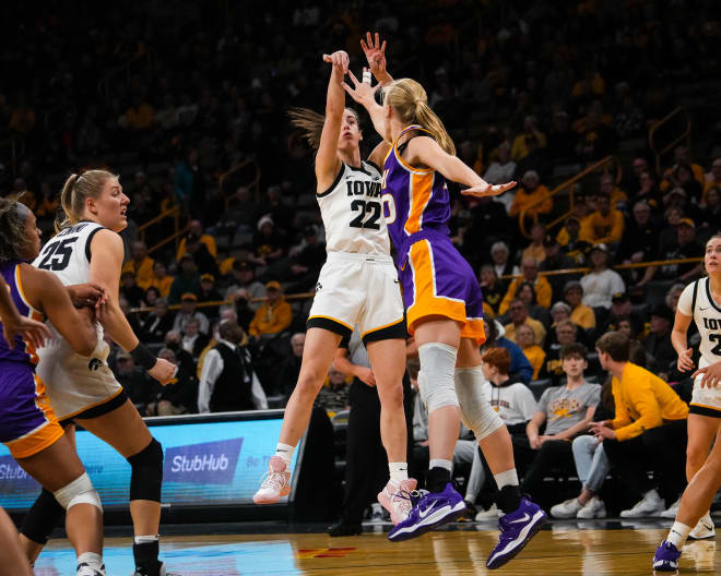 Iowa guard Caitlyn Clark (22) shoots the ball over UNI center Cynthia Wolf (30) during the game at Carver-Hawkeye Arena in Iowa City on Sunday, Dec. 18, 2022.