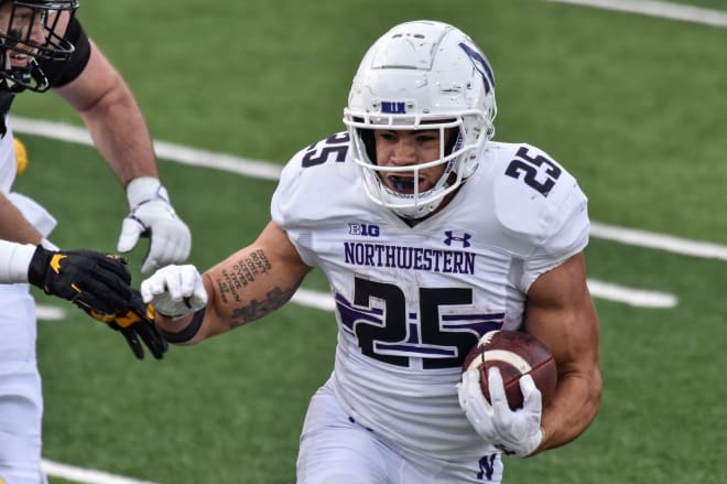 Isaiah Bowser carries the ball in a game against Iowa last season.