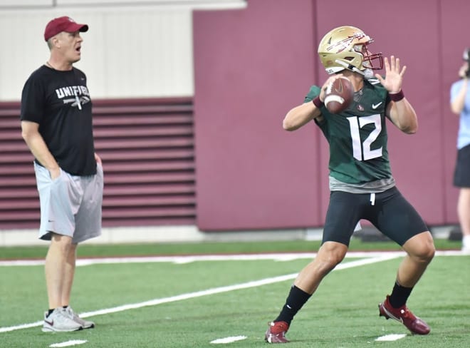 Redshirt freshman QB Chubba Purdy delivers a pass in front of tight ends coach Chris Thomsen on Saturday.