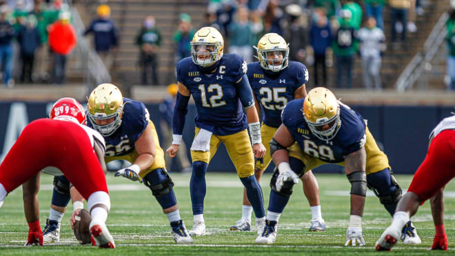 Notre Dame Fighting Irish fifth-year senior quarterback Ian Book versus Louisville this past Saturday