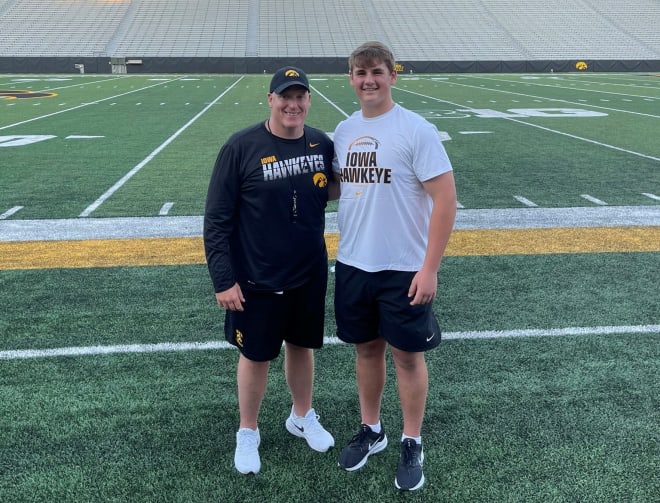 Iowa offensive line coach George Barnett with Class of 2023 offensive lineman Dylan Senda.