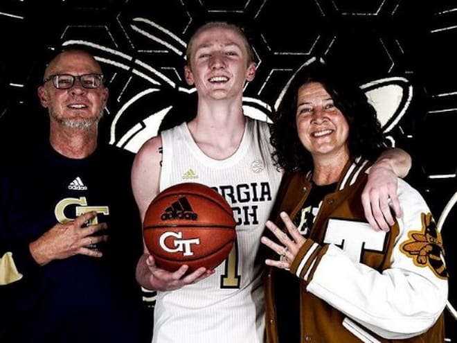 Cain poses with his family during his Georgia Tech official visit last week