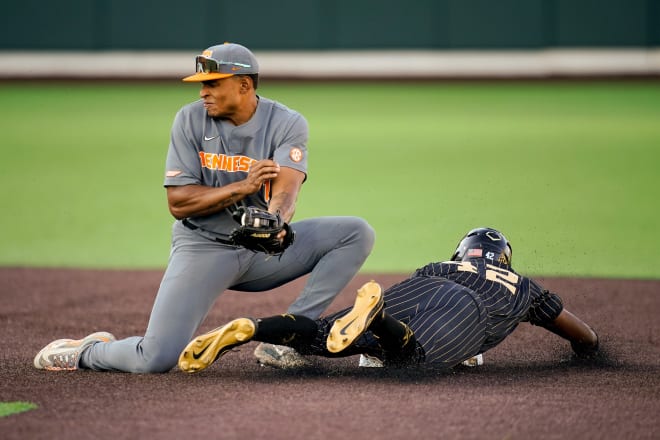 Vanderbilt first baseman RJ Austin (42) steals second base under Tennessee second baseman Christian Moore (1) during the first inning at Hawkins Field in Nashville, Tenn., Friday, May 10, 2024.