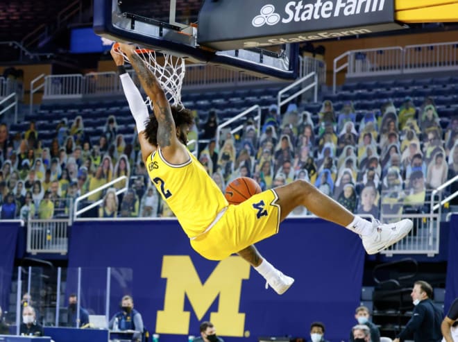 Michigan Wolverines basketball forward Isiah Livers scores on a steal and dunk against Minnesota