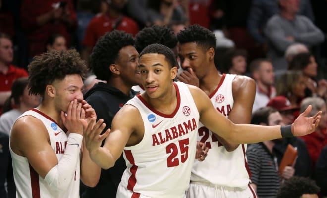 Alabama guard Mark Sears (1) and Alabama guard Nimari Burnett (25) enjoy the final minutes of the Crimson Tide s win over Maryland at Legacy Arena during the second round of the NCAA Tournament. Alabama advanced to the Sweet Sixteen with a 73-51 win over Maryland. Photo | Gary Cosby Jr.-Tuscaloosa News 