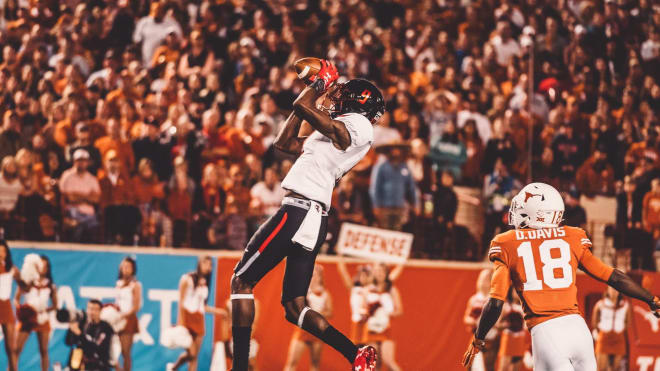 TJ Vasher goes up for a catch against the Texas Longhorns. (Photo by Texas Tech Athletics)