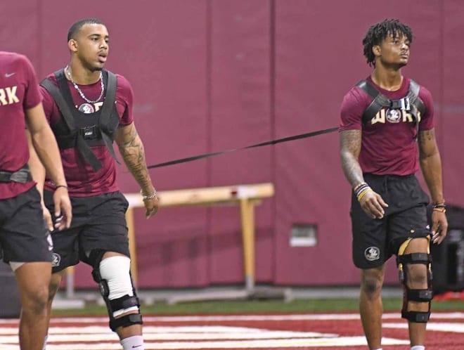 Jaiden Lars-Woodbey (left) and Keyshawn Helton work out last week during FSU's conditioning drills. Both players are coming back from serious knee injuries.