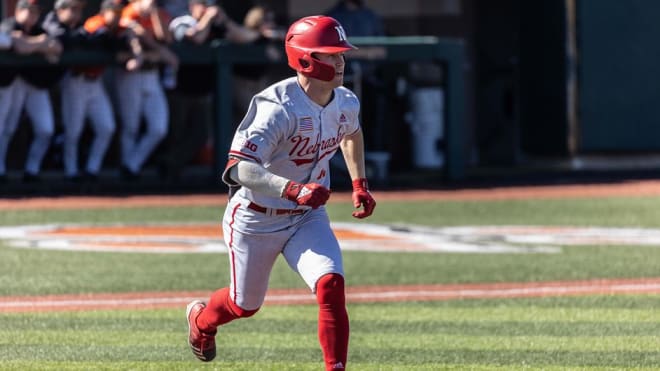 Cam Chick sprints to first base after a single. 