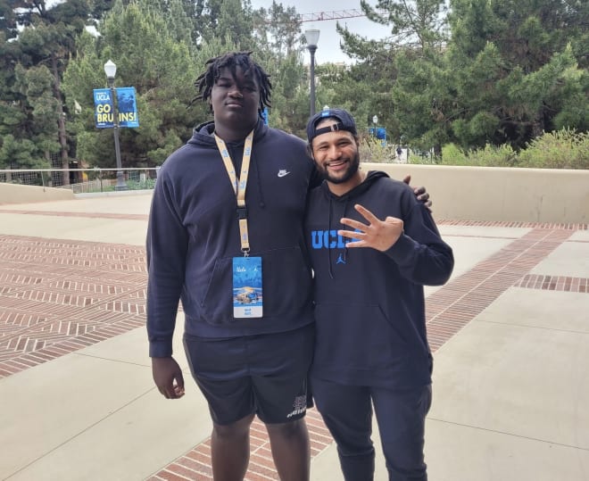 Malik White, left, a 2026 offensive tackle at Rancho Cucamonga High School, with UCLA director of player personnel Stacey Ford during an April 13 visit to Westwood.