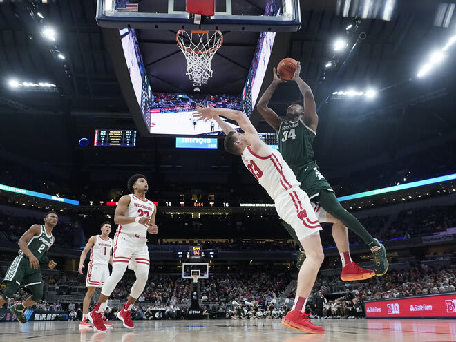 Michigan State's Julius Marble II (34) shoots over Wisconsin's Chris Vogt (33) in the first half. UW was outscored, 34-28, in the paint.