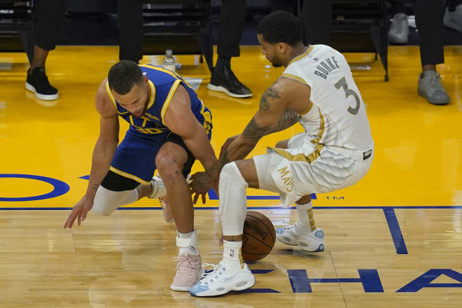 Former Michigan Wolverines basketball guard Trey Burke played stellar defense for the Dallas Mavericks against Steph Curry on Tuesday night.