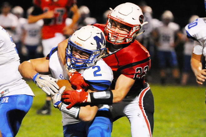 Yutan's Blake Hutton (23) corrals Malcolm's Adam Stewart (2) during Friday's game won by Yutan 48-14. The Chieftains are ranked No. 8 in Class C-2 following their fifth consecutive win.