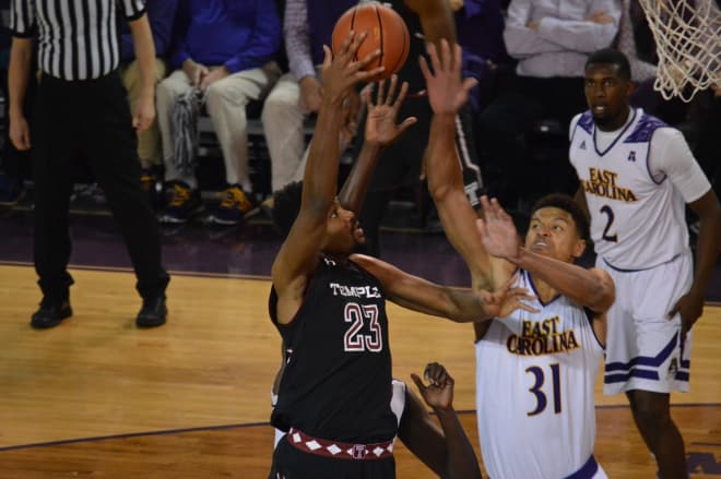 Temple's Damion Moore shoots over East Carolina's Andre Washington in the Pirates 78-64 victory.