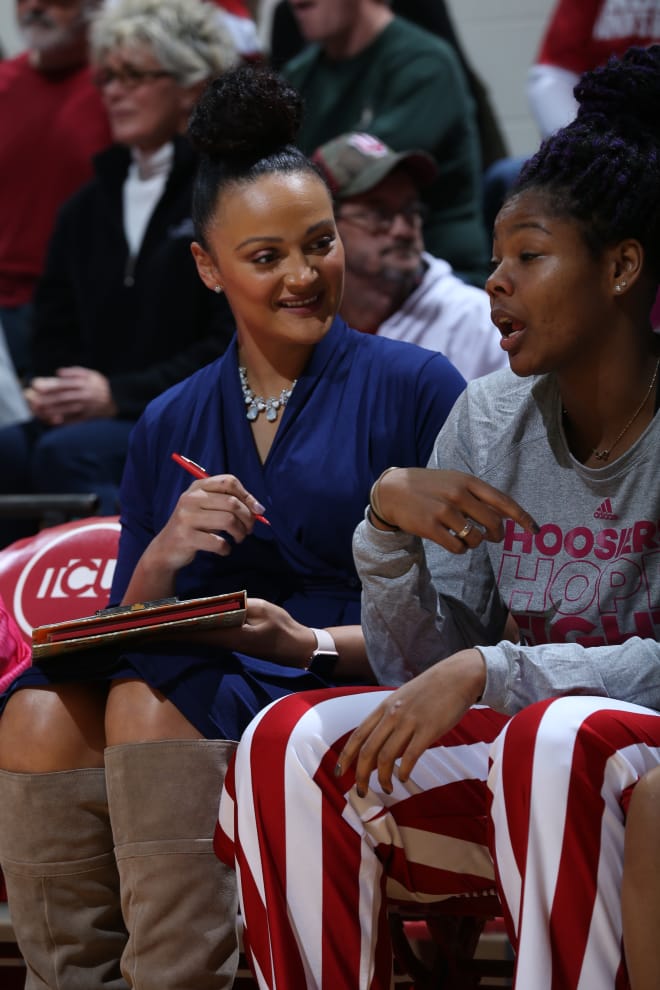 Mistie Bass chats with IU sophomore center Danielle Williams. The two have worked together all season, and Williams has seen significant growth in her game because of it, head coach Teri Moren said.