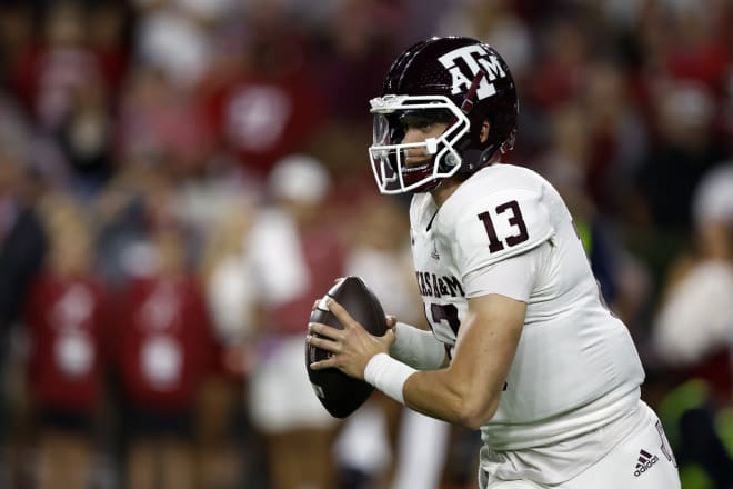 Oct 8, 2022; Tuscaloosa, Alabama, USA; Texas A&M Aggies quarterback Haynes King (13) rolls out to pass against the Alabama Crimson Tide during the first half at Bryant-Denny Stadium.
