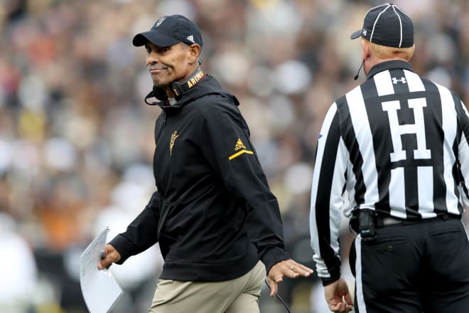 ASU head coach Herm Edwards speaking with refs during the CU/ASU game at Folsom Field on Oct. 6 2018