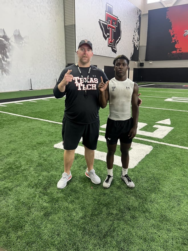 Daveon Singleton and Red Raiders OL coach Stephen Hamby