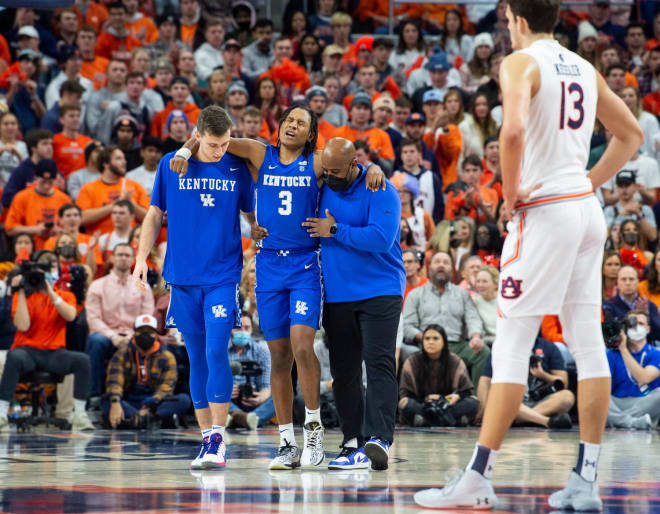 Kentucky's TyTy Washington was helped off the court after rolling an ankle with 8:21 remaining in the first half.