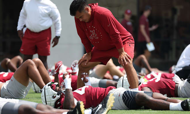 Former Alabama inside linebacker coach Robert Bala talks with players during practice. Photo | Alabama Athletics 