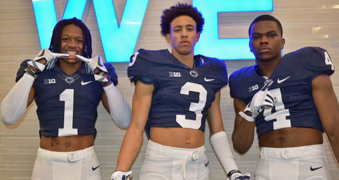 Marquis Wilson (left) and Tyler Rudolph (right) pose with PSU commit Keaton Ellis during the Feb. 3 Jr. Day. 