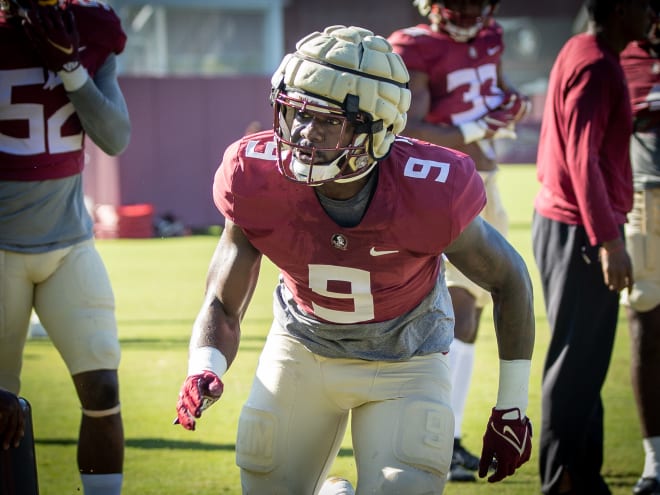 Derrick McLendon runs through a drill earlier in camp.