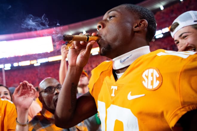 Tennessee receiver Squirrel White smokes a cigar following the Vols' 52-49 win over Alabama at Neyland Stadium on Oct. 15, 2022. 