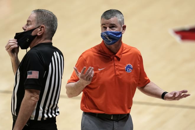 Boise State head coach Leon Rice, right, talks with an official during the second half of an NCAA college basketball game Saturday, Feb 27, 2021, in San Diego.