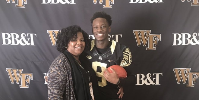 Woulard poses with his mother during his JR Day visit to Winston-Salem