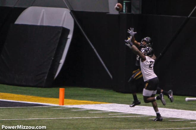 DeMarkus Acy defends a deep ball during Missouri's first spring practice on Sunday.
