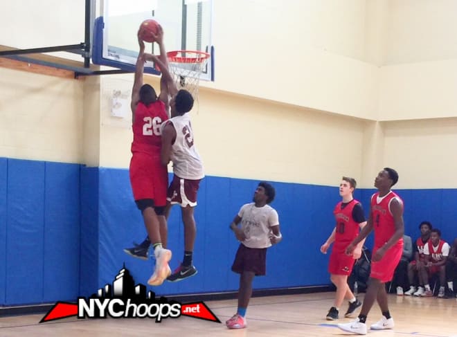 Zed Key (#26) takes it up and over his defender at the rim