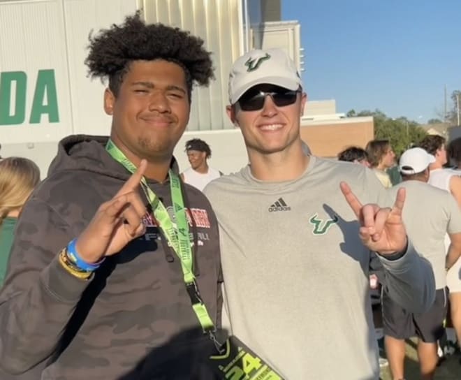 Raymond poses with USF offensive line coach Tyler Hudanick