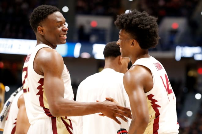 Mfiondu Kabengele (left) and Terance Mann share a smile during their college days at Florida State.
