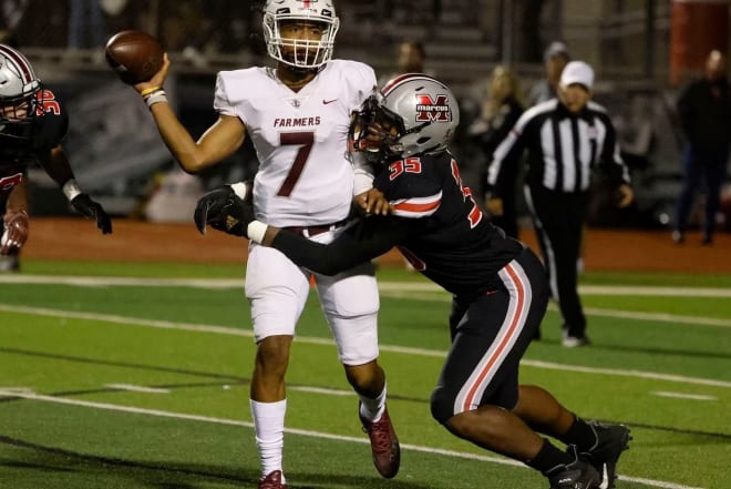 Will Upshaw (35) tackles the quarterback during his junior season.