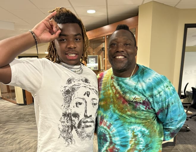 High three-star defensive lineman Trajen Odom poses with Colorado graduate assistant Warren Sapp during his visit with the Buffs.