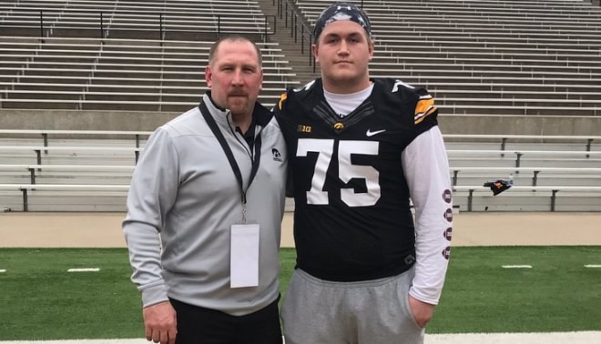 Zach Ross with Iowa offensive line coach Tim Polasek at the Hawkeyes' junior day Sunday.